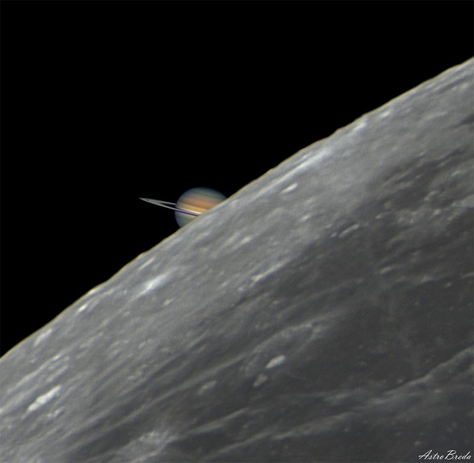 A picture of the edge of the Earth's familiar Moon
takes up the right part of the frame, while a partial image
of Saturn is visible just behind it on the left.
Please see the explanation for more detailed information.