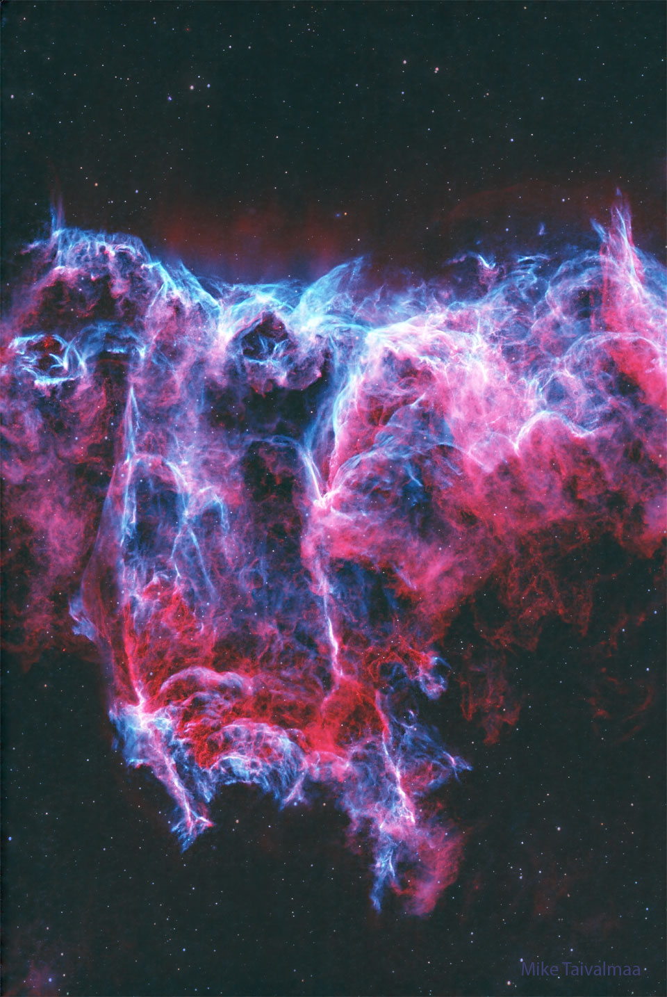 The featured image shows a starfield with a two-
colored nebula in the center. The nebula is colored
mostly red and blue.
Please see the explanation for more detailed information.