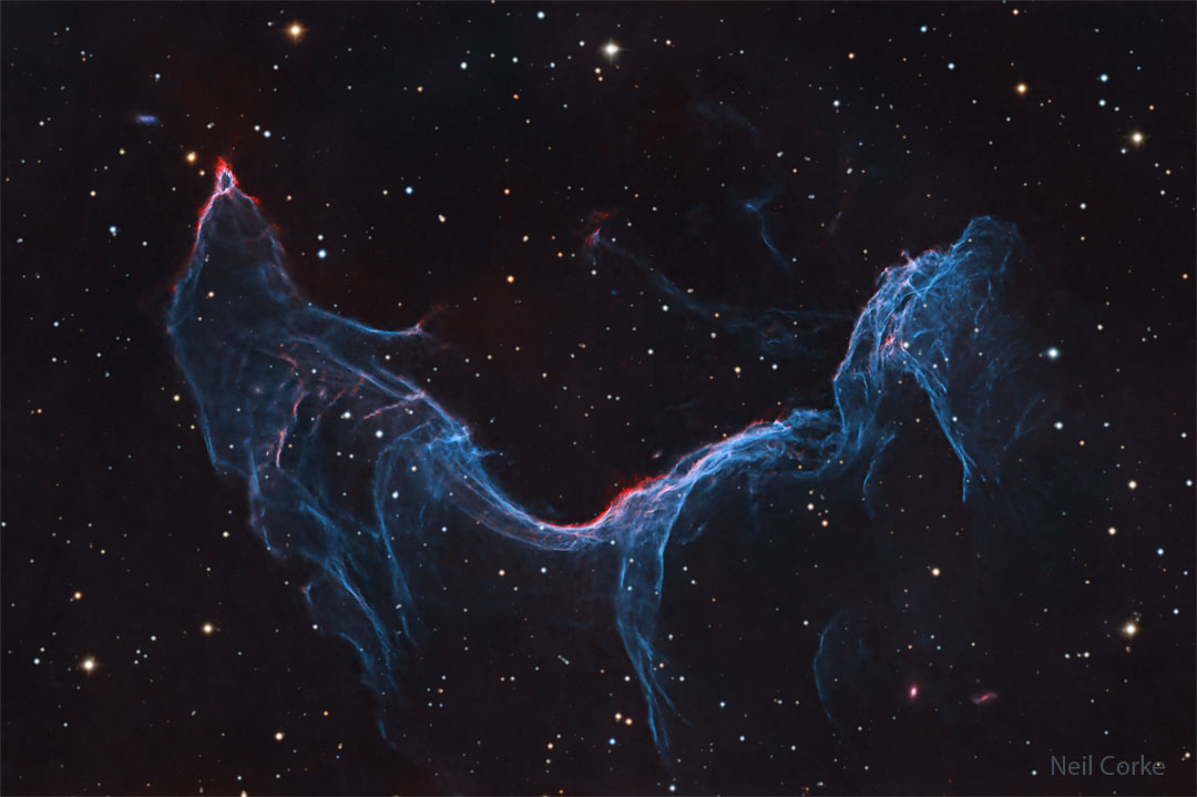 A starfield is shown with a long blue-glowing nebula
taking up much of the frame. The nebula appears, to some,
similar to a fish or a mermaid.
Please see the explanation for more detailed information.