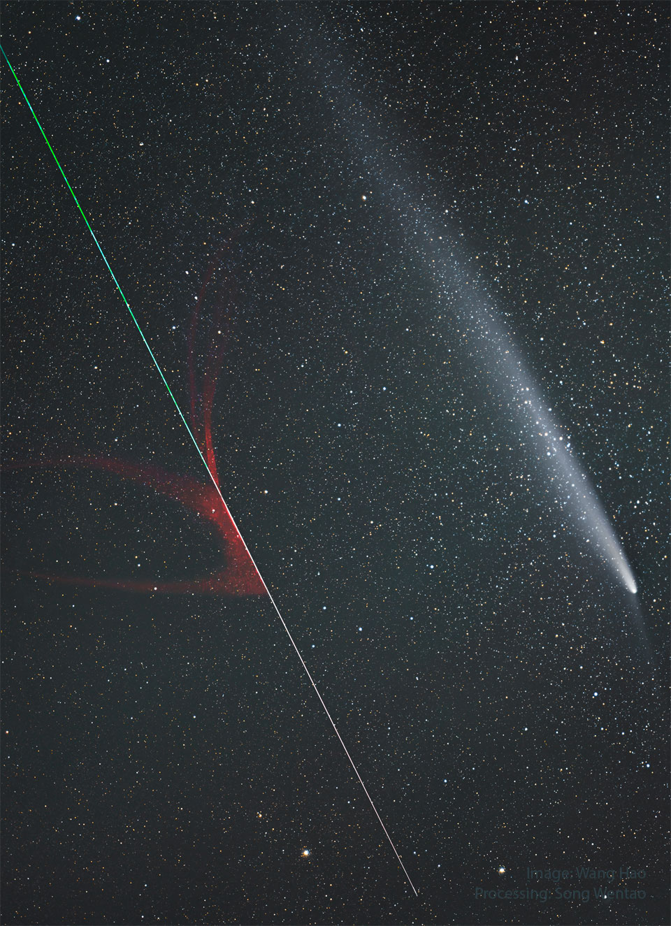 A star-filled sky has two streaks in the foreground. A green
and red streak toward the lower left was created by an ablating
meteor, while the blue and white streak on the upper right is
the coma and tail of a comet.
Please see the explanation for more detailed information.