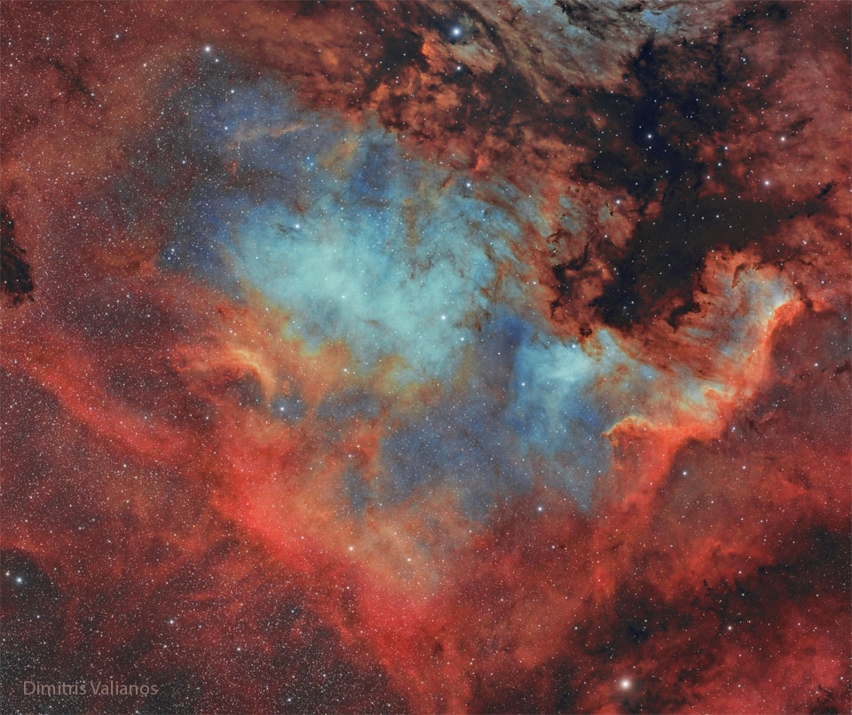 A star field is dominated by a red and blue glowing
nebula. This nebula appears, to some, to have the shape
of North America and so is called the North America Nebula.
Please see the explanation for more detailed information.