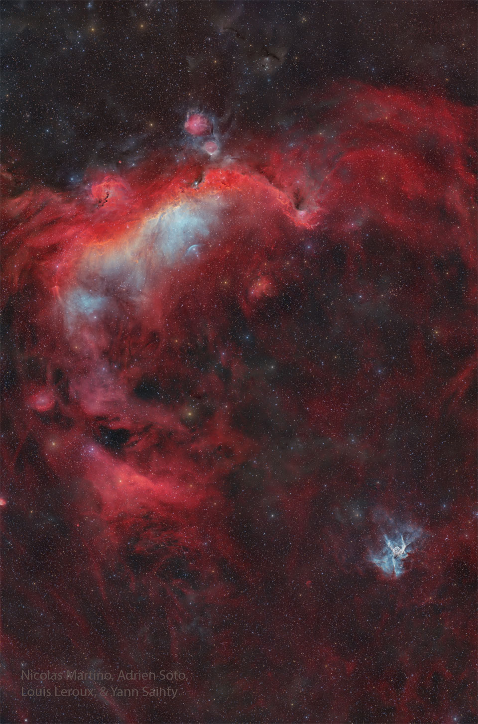 A tall starscape appears to have two bright nebulas.
The large one at the top is colored mostly red and is known
as the Seagull Nebula. The small one near the bottom right
is known as Thor's Helmet.
Please see the explanation for more detailed information.