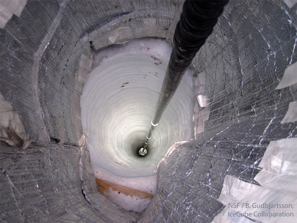 A dark cable descends into a deep carved hole of ice.
The hole is so deep that it disappears into darkness.
Please see the explanation for more detailed information.